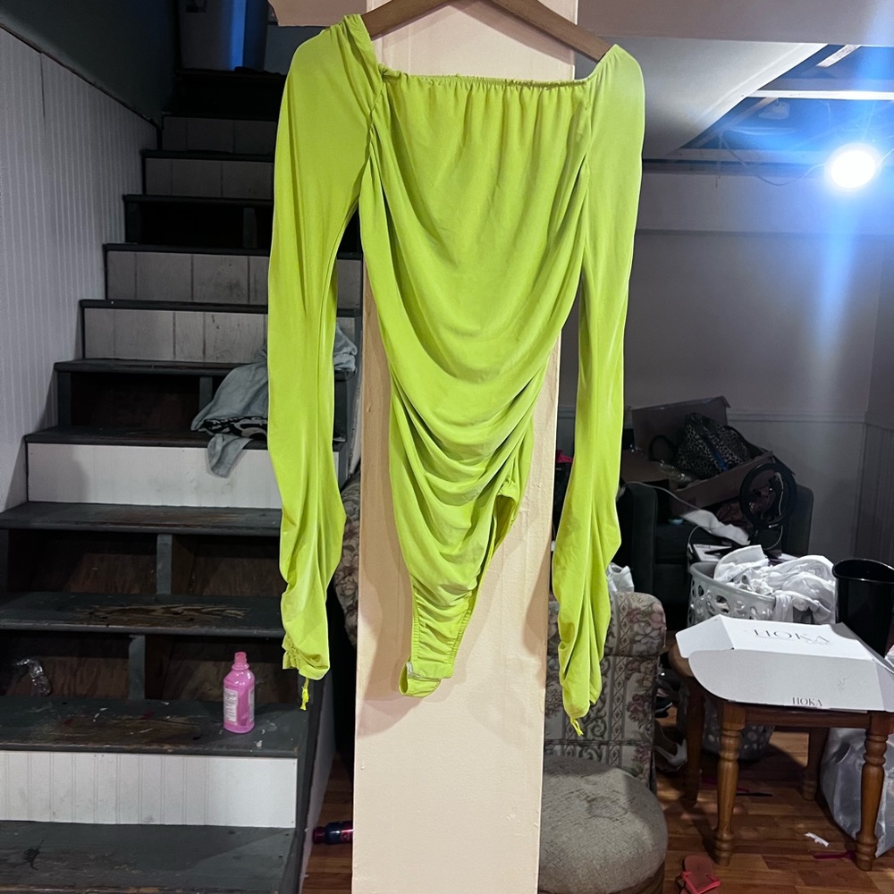 Lime green runched body suit, two button clips at bottom. Off the shoulder
